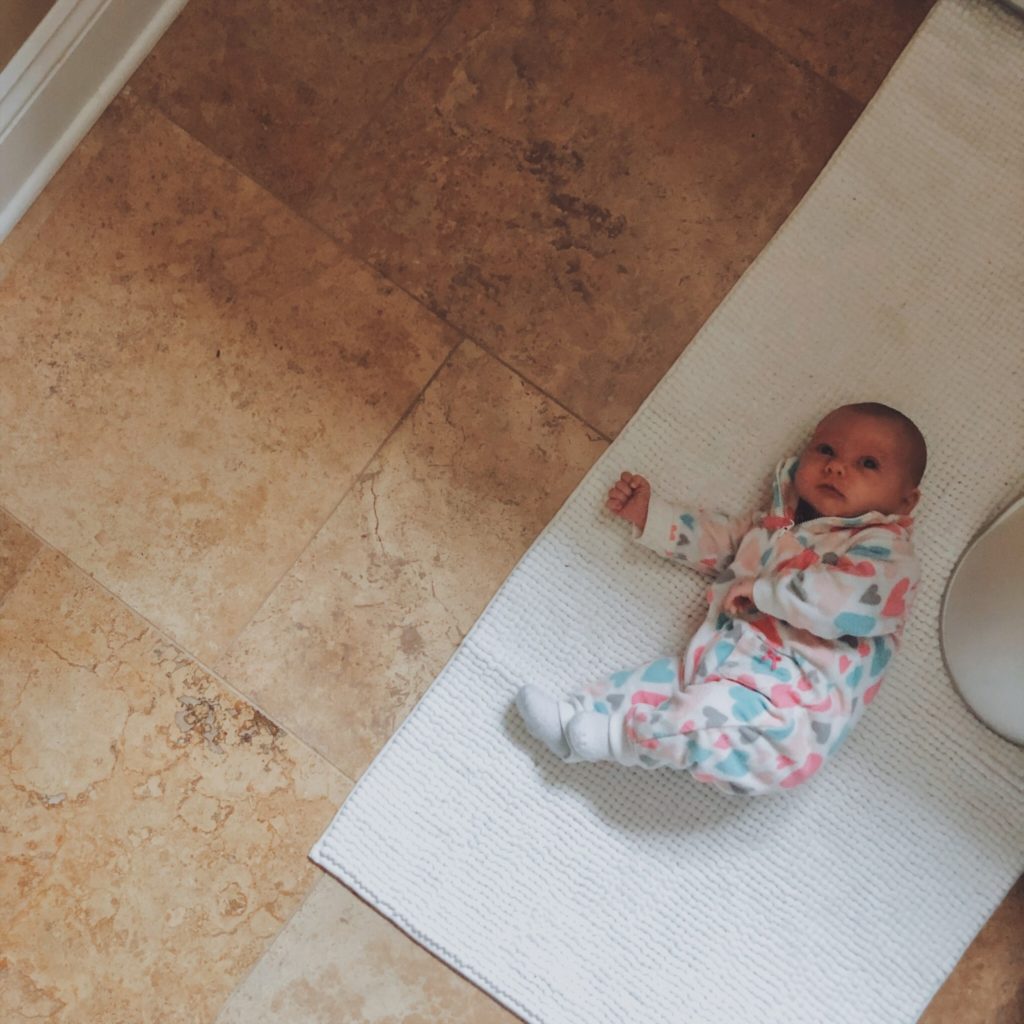 baby on the bathroom floor